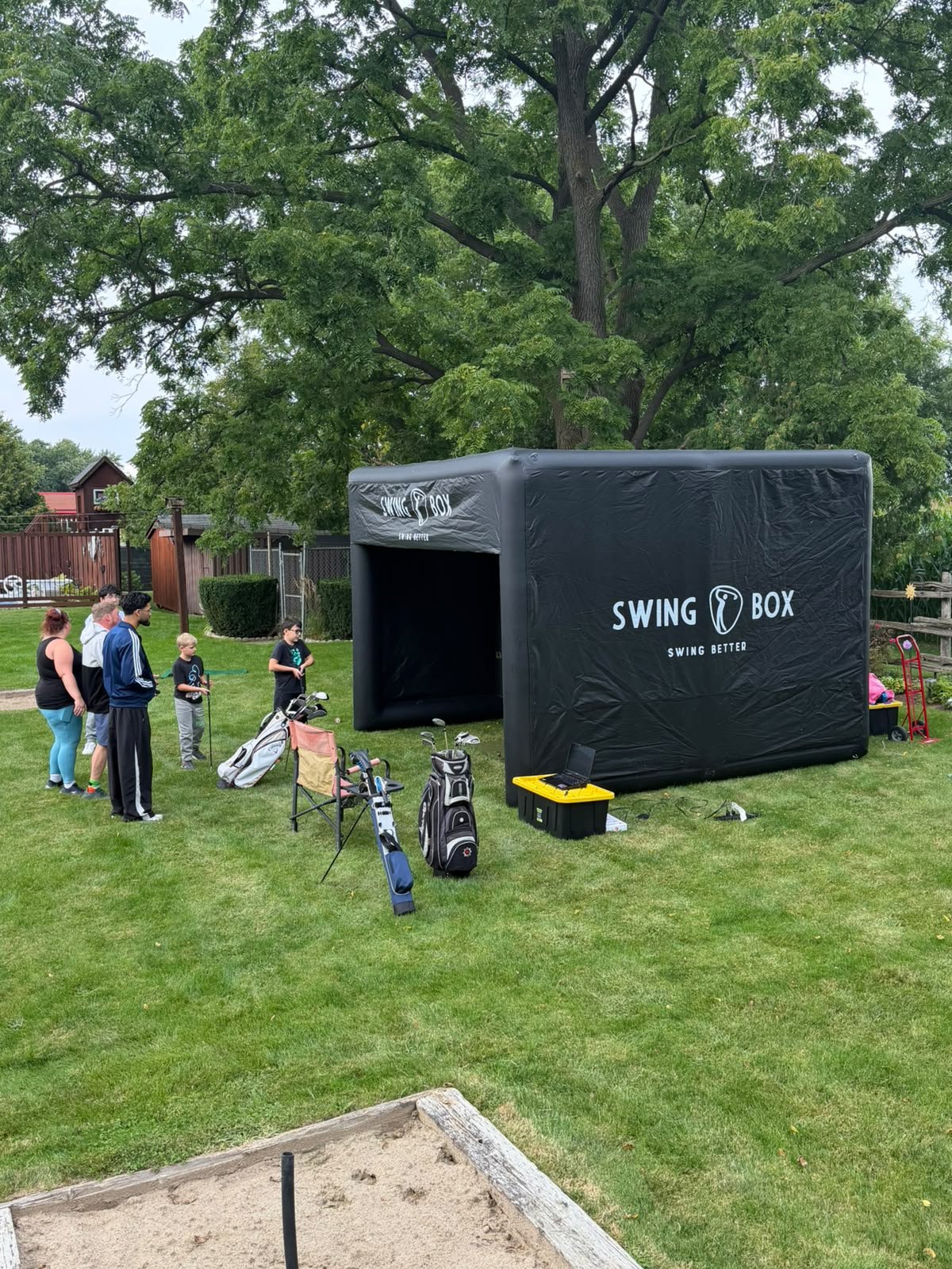 Swing Box outdoor golf simulator with guests