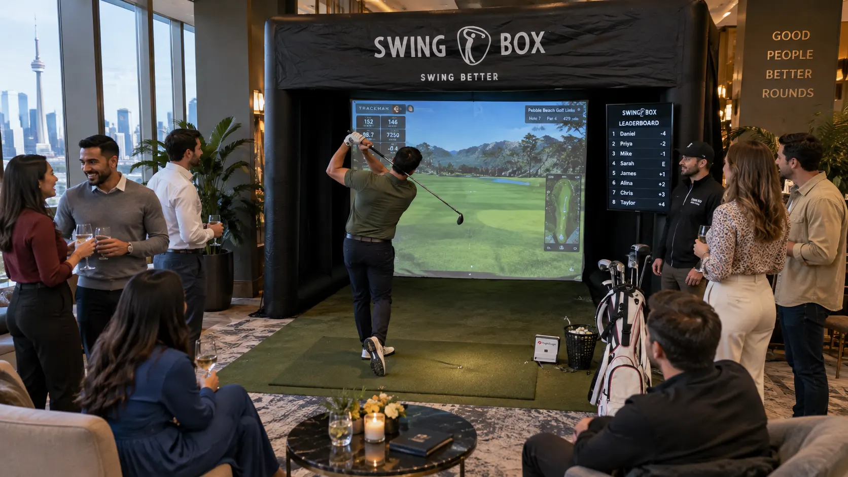 Friends enjoying a private Swing Box golf event in a modern Toronto venue