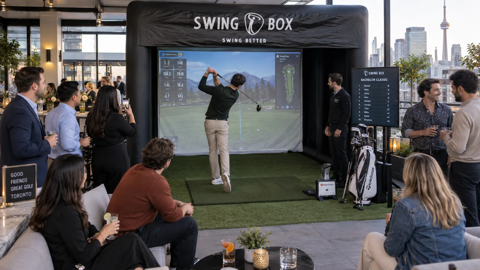 Bachelor party guests enjoying Swing Box golf with a Toronto skyline and live leaderboard